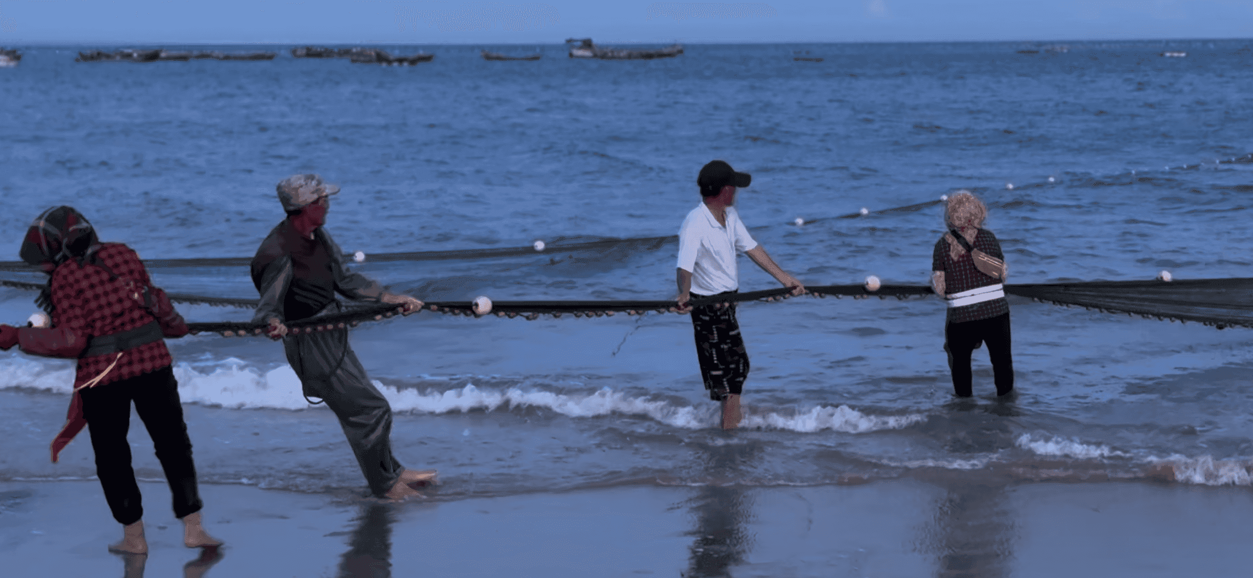 Fishermen pulling up the fishing net